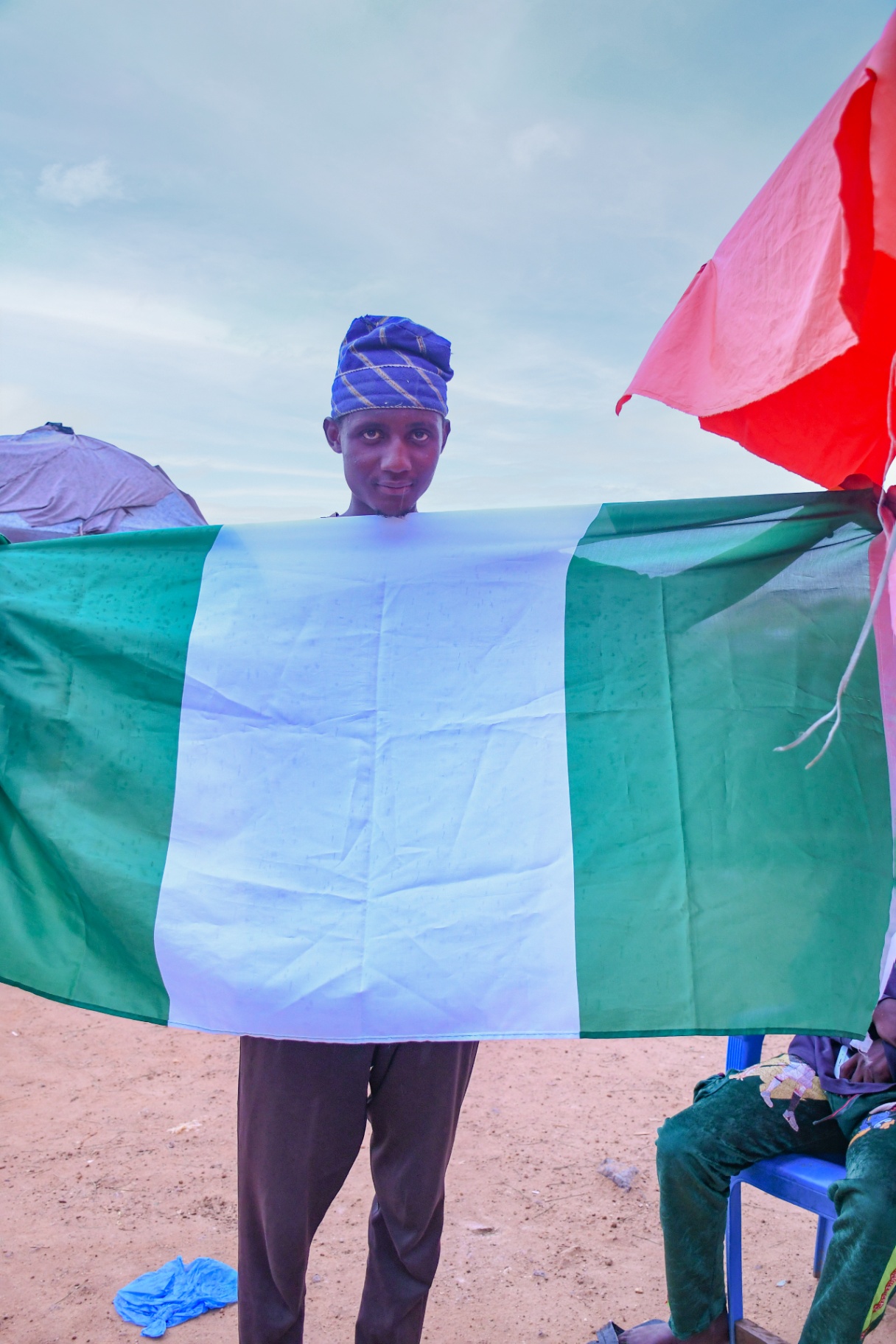 Boy in Blue Cap, Flag Held Wide , Lugbe (Airport Road), FCT