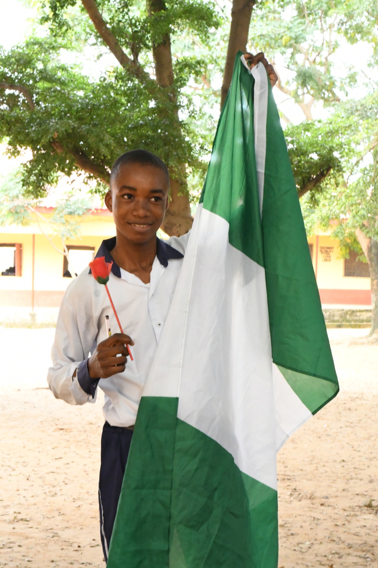 Schoolboy Lifts the Flag , Lugbe (Airport Road), FCT